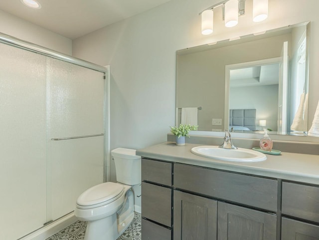 bathroom with tile patterned flooring, vanity, toilet, and a shower stall