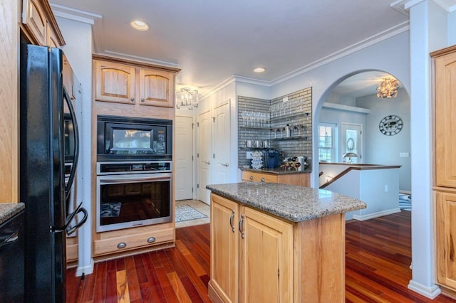 kitchen with ornamental molding, black appliances, and dark wood-type flooring