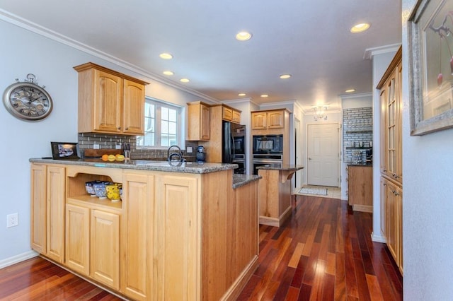 kitchen with dark wood-style flooring, a peninsula, a kitchen bar, backsplash, and black appliances