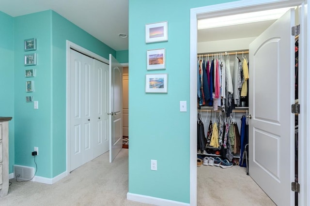 carpeted bedroom featuring baseboards