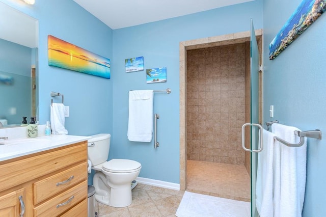 full bathroom with vanity, toilet, tile patterned floors, baseboards, and a shower stall