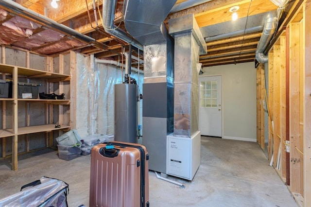 unfinished below grade area featuring heating unit and gas water heater