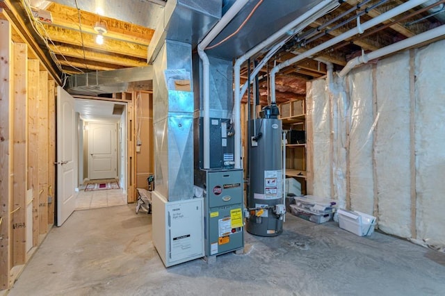 unfinished below grade area featuring water heater and heating unit