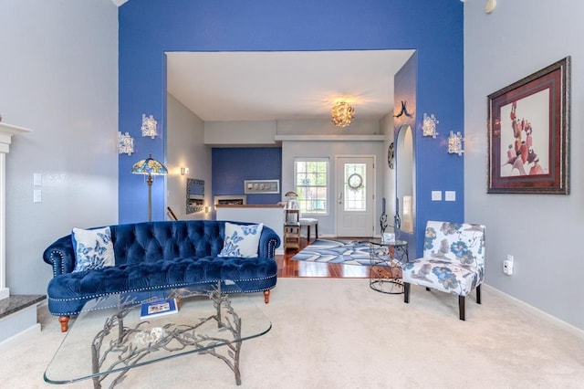living room featuring baseboards and carpet