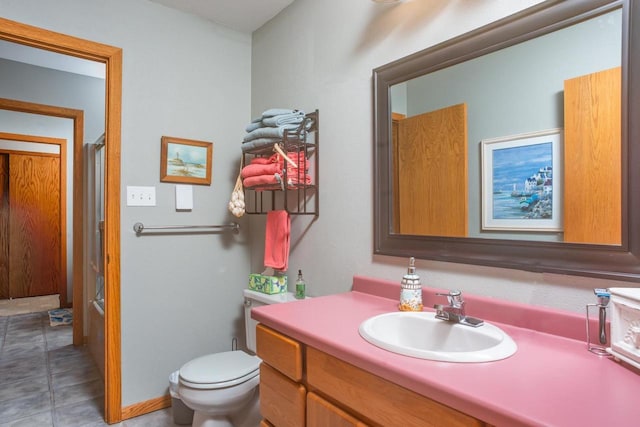 full bath featuring vanity, a shower, and toilet