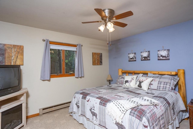 bedroom with carpet flooring, baseboards, ceiling fan, and baseboard heating