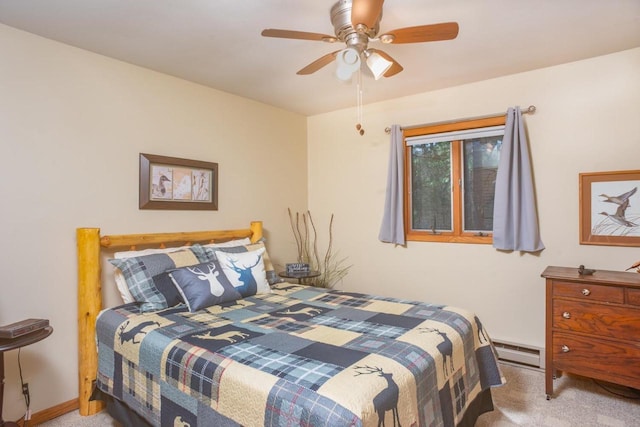 carpeted bedroom with baseboards, ceiling fan, and a baseboard heating unit