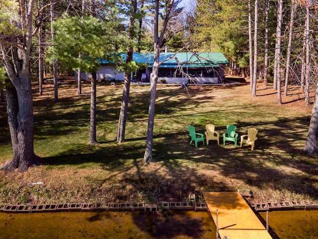 view of yard featuring a boat dock