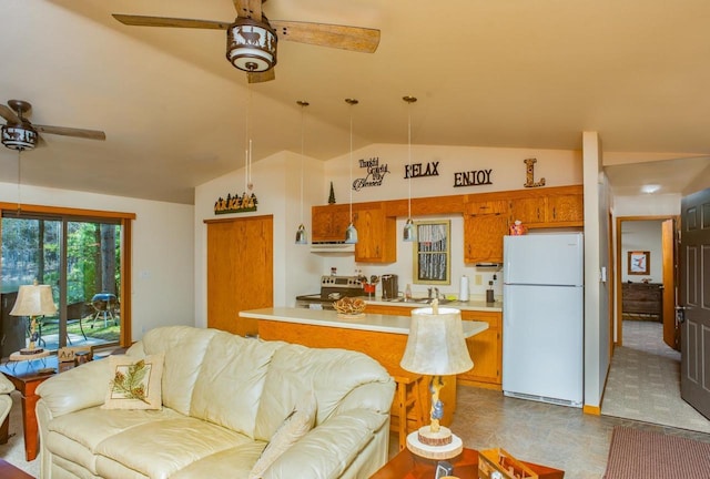 living area featuring ceiling fan and vaulted ceiling