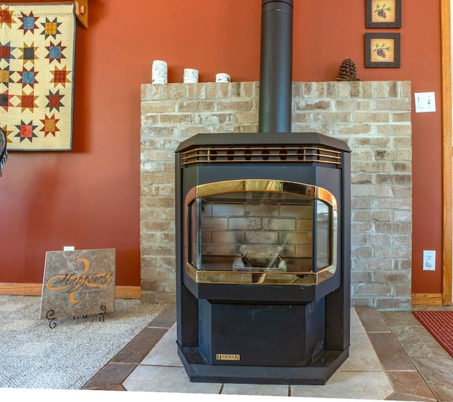 interior details featuring baseboards and a wood stove