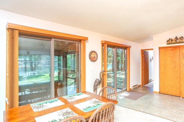 dining space with a baseboard heating unit