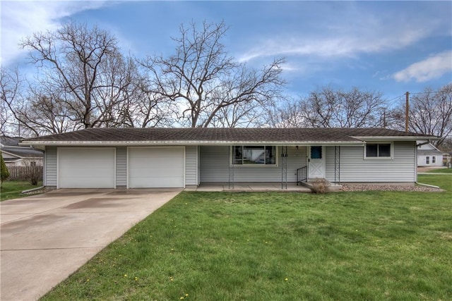 ranch-style house featuring an attached garage, driveway, and a front yard