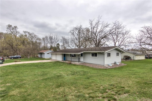 single story home featuring concrete driveway, a garage, covered porch, and a front lawn