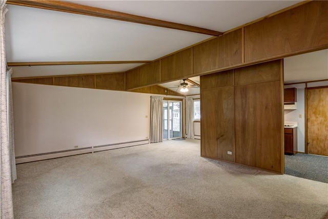 unfurnished room with ceiling fan, a baseboard heating unit, light carpet, and vaulted ceiling with beams