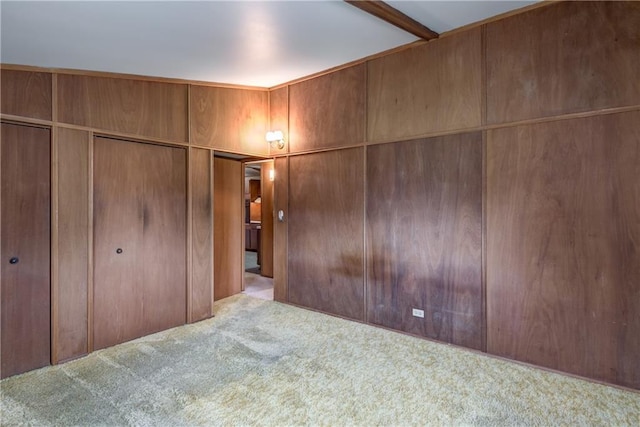 unfurnished bedroom with a closet and carpet