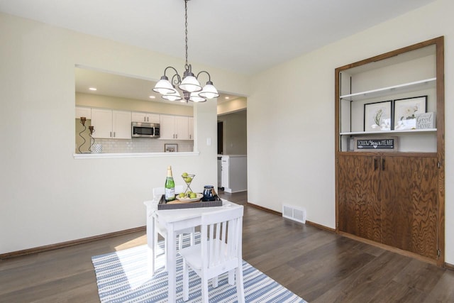 dining area with visible vents, dark wood finished floors, baseboards, a chandelier, and recessed lighting