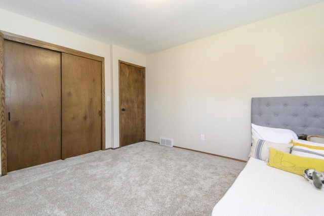 bedroom with carpet floors and visible vents