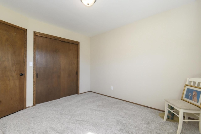 unfurnished bedroom with baseboards and carpet flooring