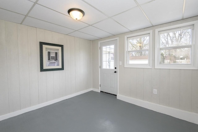 entryway with concrete flooring and baseboards