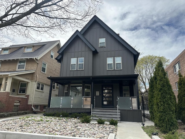 2627 N Farwell Ave, Milwaukee, WI 53211 - view of front facade featuring covered porch and board and batten siding