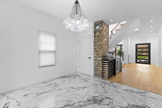 2627 N Farwell Ave, Milwaukee, WI 53211 - dining space with recessed lighting, stairway, marble finish floors, a chandelier, and baseboards