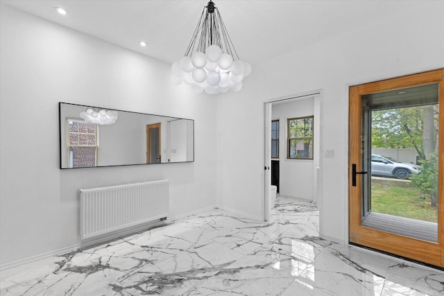 2627 N Farwell Ave, Milwaukee, WI 53211 - unfurnished dining area featuring a chandelier, radiator heating unit, light marble finish flooring, baseboards, and recessed lighting