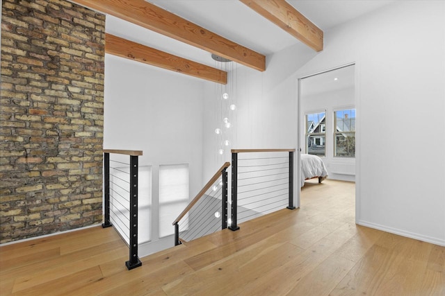 2627 N Farwell Ave, Milwaukee, WI 53211 - hallway with an upstairs landing, beamed ceiling, and hardwood / wood-style floors