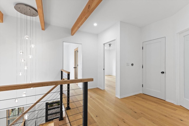 2627 N Farwell Ave, Milwaukee, WI 53211 - hall with light wood-style floors, beamed ceiling, an upstairs landing, baseboards, and recessed lighting