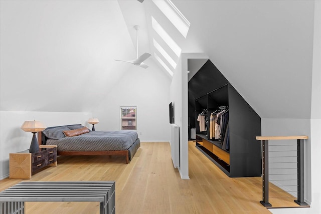 2627 N Farwell Ave, Milwaukee, WI 53211 - bedroom featuring vaulted ceiling, light wood-style floors, and baseboards