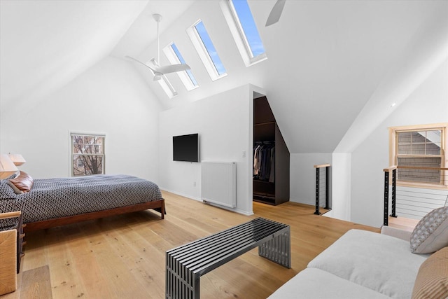 2627 N Farwell Ave, Milwaukee, WI 53211 - bedroom with a skylight, high vaulted ceiling, wood finished floors, a spacious closet, and ceiling fan