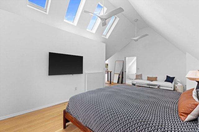 2627 N Farwell Ave, Milwaukee, WI 53211 - bedroom with a skylight, light wood finished floors, vaulted ceiling, and baseboards