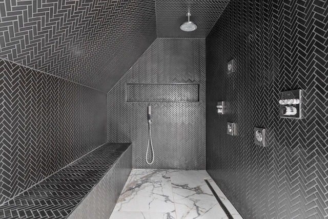 2627 N Farwell Ave, Milwaukee, WI 53211 - bathroom featuring marble look tile flooring and a tile shower