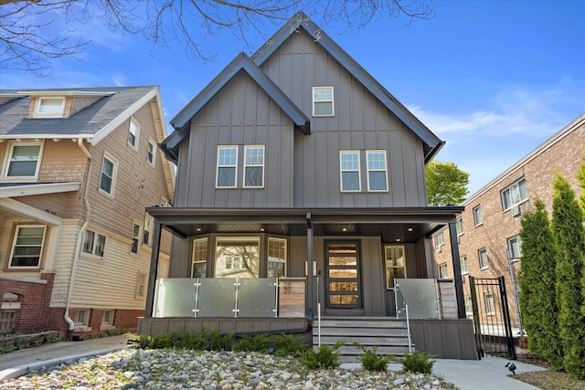 2627 N Farwell Ave, Milwaukee, WI 53211 - view of front facade featuring a porch and board and batten siding