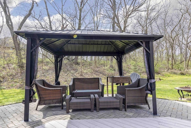 deck with an outdoor hangout area, a gazebo, a yard, and a patio area