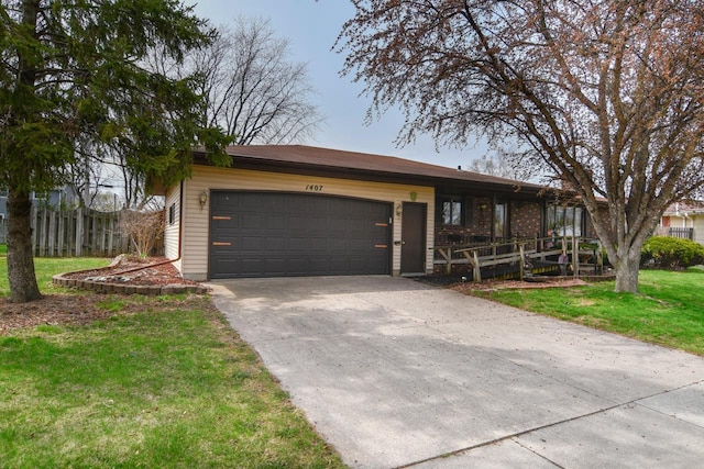 ranch-style home with concrete driveway, an attached garage, fence, and a front yard