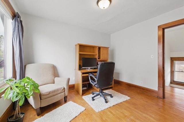 office with baseboards and light wood-type flooring