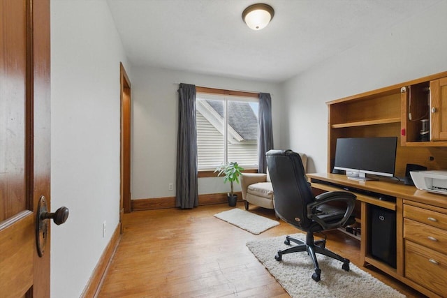 office with baseboards and light wood-type flooring