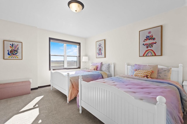 bedroom with carpet flooring and baseboards