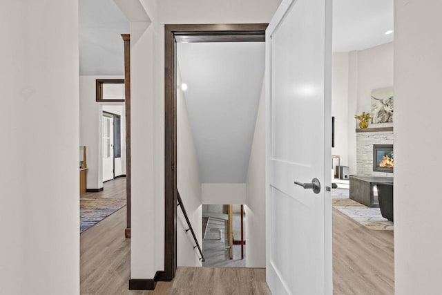 corridor featuring wood finished floors