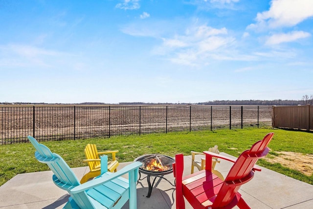view of patio with a fire pit and fence