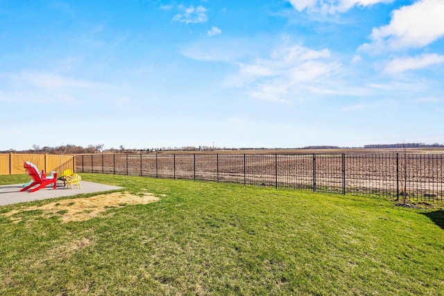 view of yard featuring a patio area and fence