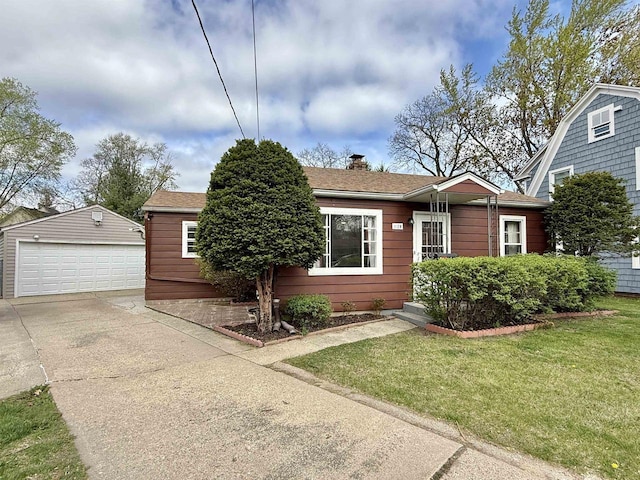 view of front of property with a garage, a front lawn, an outbuilding, and a chimney