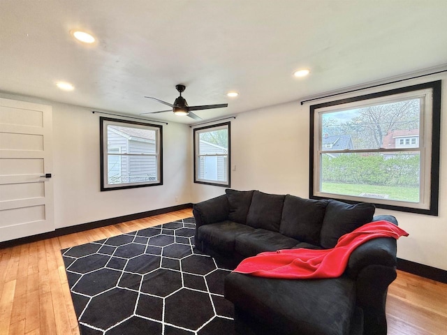 living area with recessed lighting, baseboards, ceiling fan, and wood finished floors