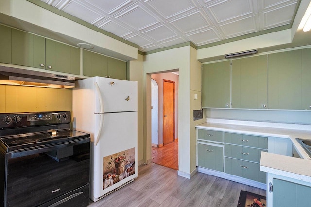 kitchen with electric range, light wood-style flooring, freestanding refrigerator, under cabinet range hood, and green cabinets