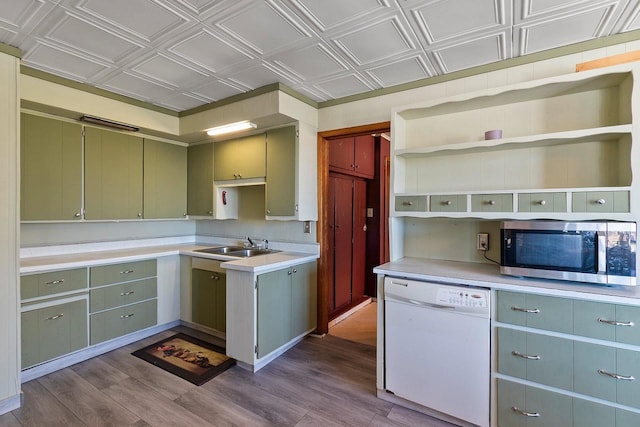 kitchen featuring white dishwasher, an ornate ceiling, stainless steel microwave, and dark wood-style floors