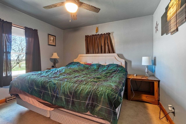 bedroom with baseboards, carpet flooring, and ceiling fan