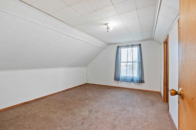 bonus room featuring baseboards, carpet flooring, and lofted ceiling