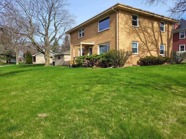 back of property with a lawn