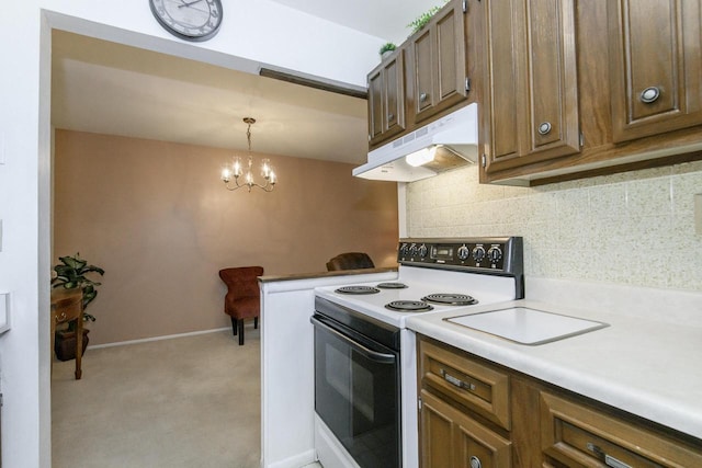 kitchen with light carpet, light countertops, decorative backsplash, under cabinet range hood, and range with electric stovetop