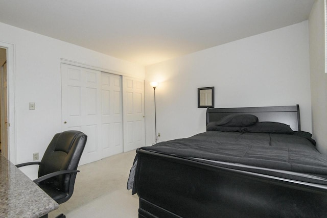 carpeted bedroom with a closet